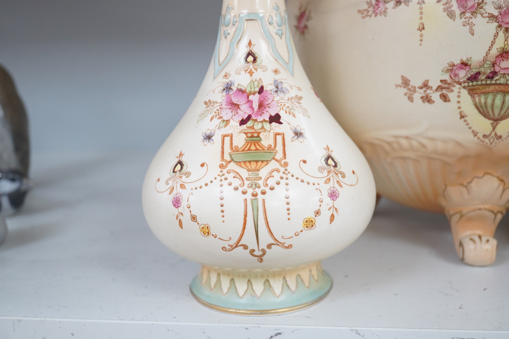 A Crown Devon jardiniere, 23cm high, and a pair of vases, 25.5cm high. Condition - fair to good